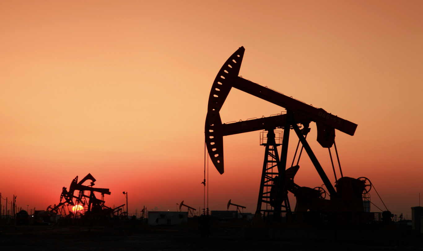 oil rig against a sunset